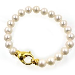 Armband zoetwater parels met groot 18 kt gouden slot