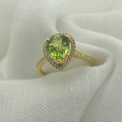 18 kt rosé gouden ring met een druppelvormige peridot