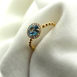 18 kt rosé gouden bolletjes ring met blauwe topaas